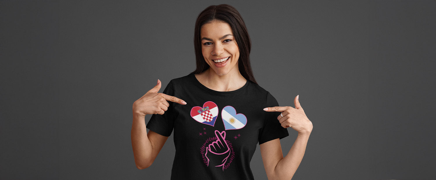 Woman wearing a black T-shirt with two country flags as hearts.